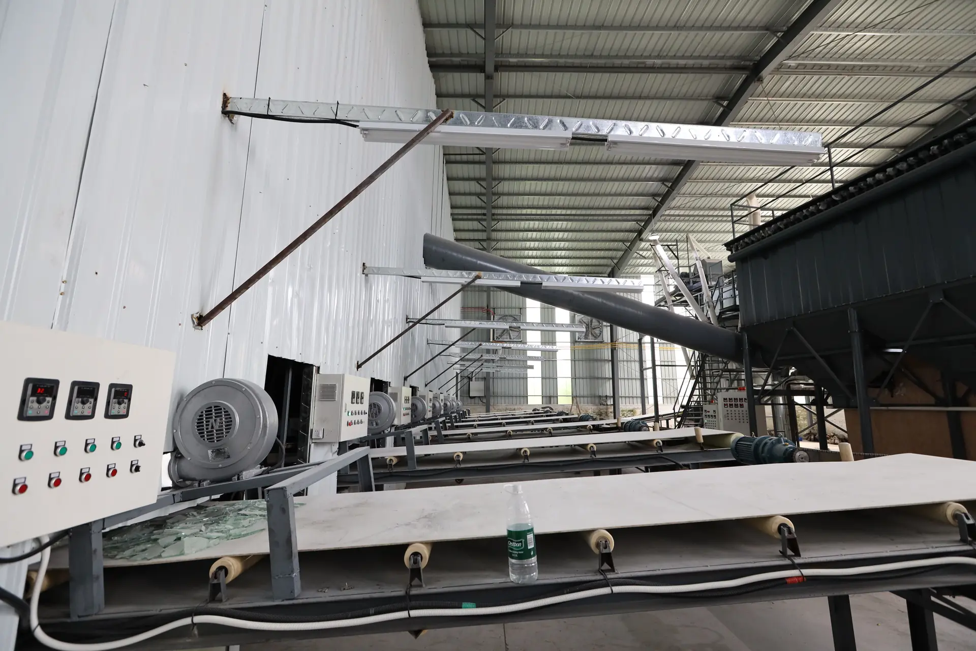 Conveyor lines and equipment in a material-processing workshop