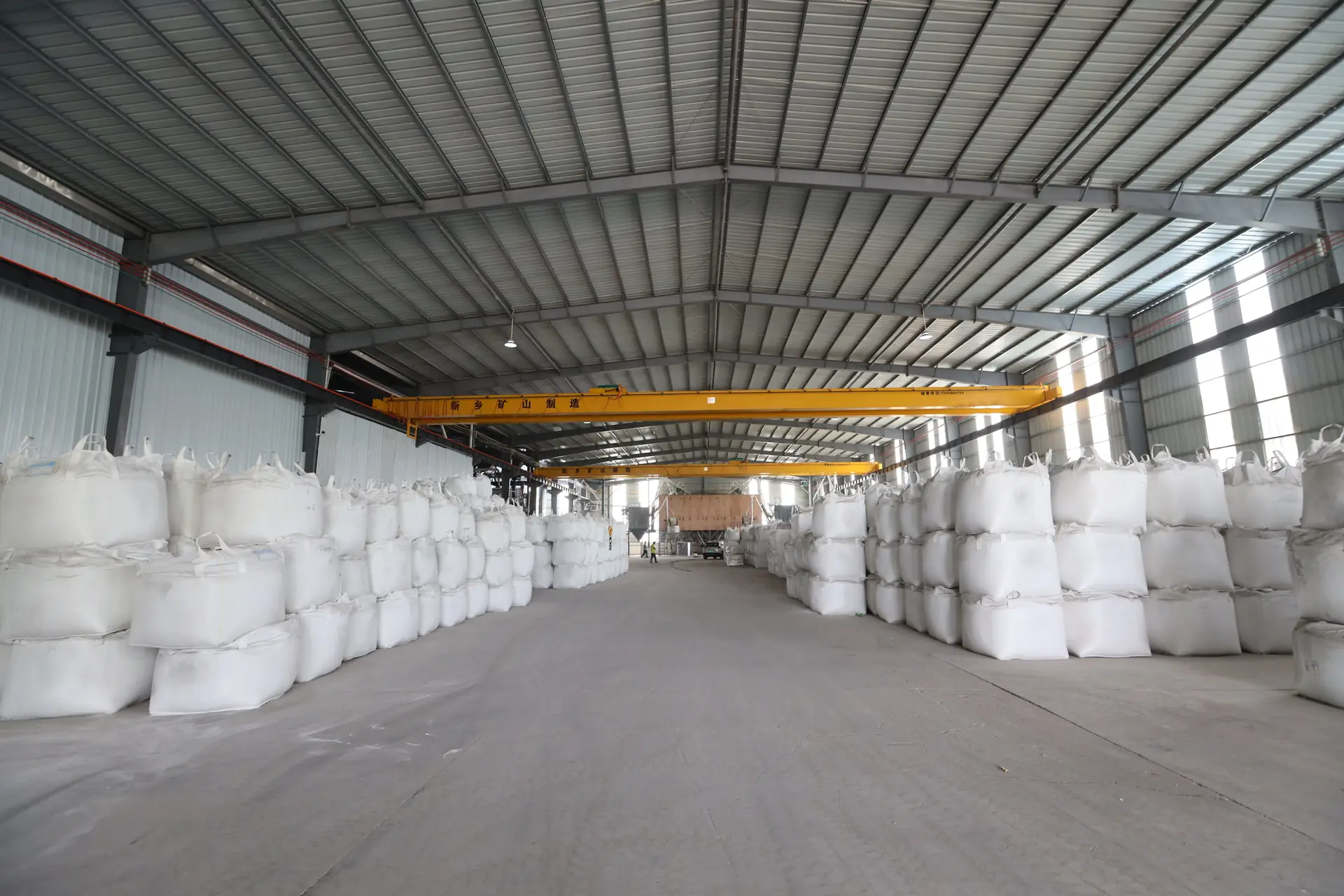 Warehouse with bulk bags and lifting equipment
